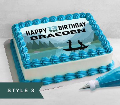 A rectangular birthday cake with bright blue piped frosting borders and sides, decorated with a scenic mountain landscape print and the text 'HAPPY 13th BIRTHDAY BRAEDEN.' A piping bag with blue frosting sits beside the cake, and a dark teal banner in the lower left reads 'STYLE 3.