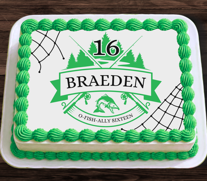 A rectangular frosted cake on a white plate, decorated with bright green piped frosting around the border and a white top featuring a green fishing-themed graphic with the number 16, the name BRAEDEN, and the phrase O-FISH-ALLY SIXTEEN.