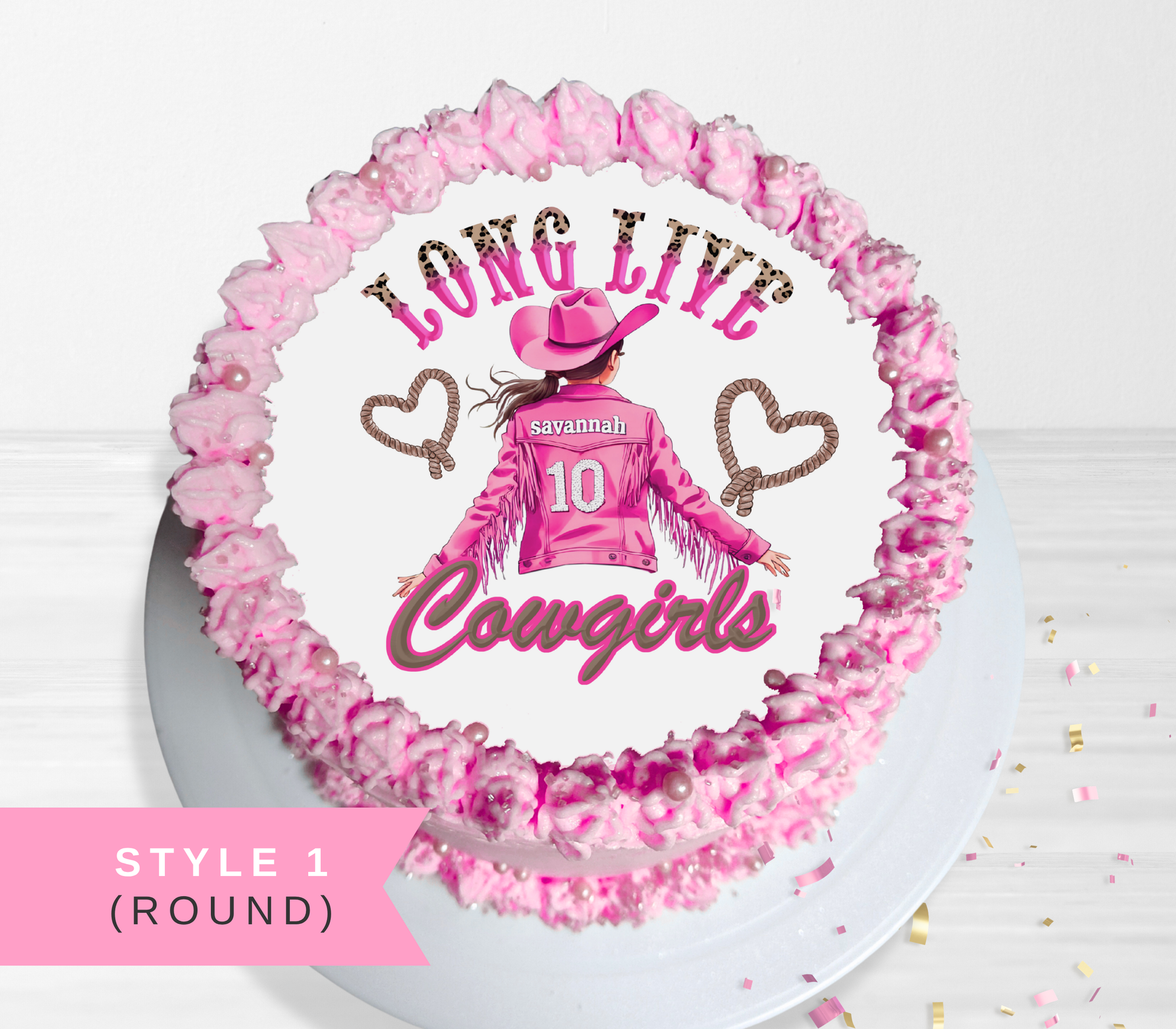 A round cake decorated with pink frosting and a custom western-themed topper showing a girl in a pink cowboy outfit with the text 'LONG LIVE Cowgirls' and 'Savannah 10'.
