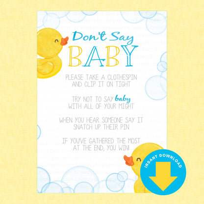A baby shower game card titled 'Don't Say BABY' with a white background, blue and yellow text, yellow rubber duck illustrations, and blue bubble graphics, set against a pale yellow background. A blue circular badge in the lower right says 'Instant Download' with a yellow download icon.