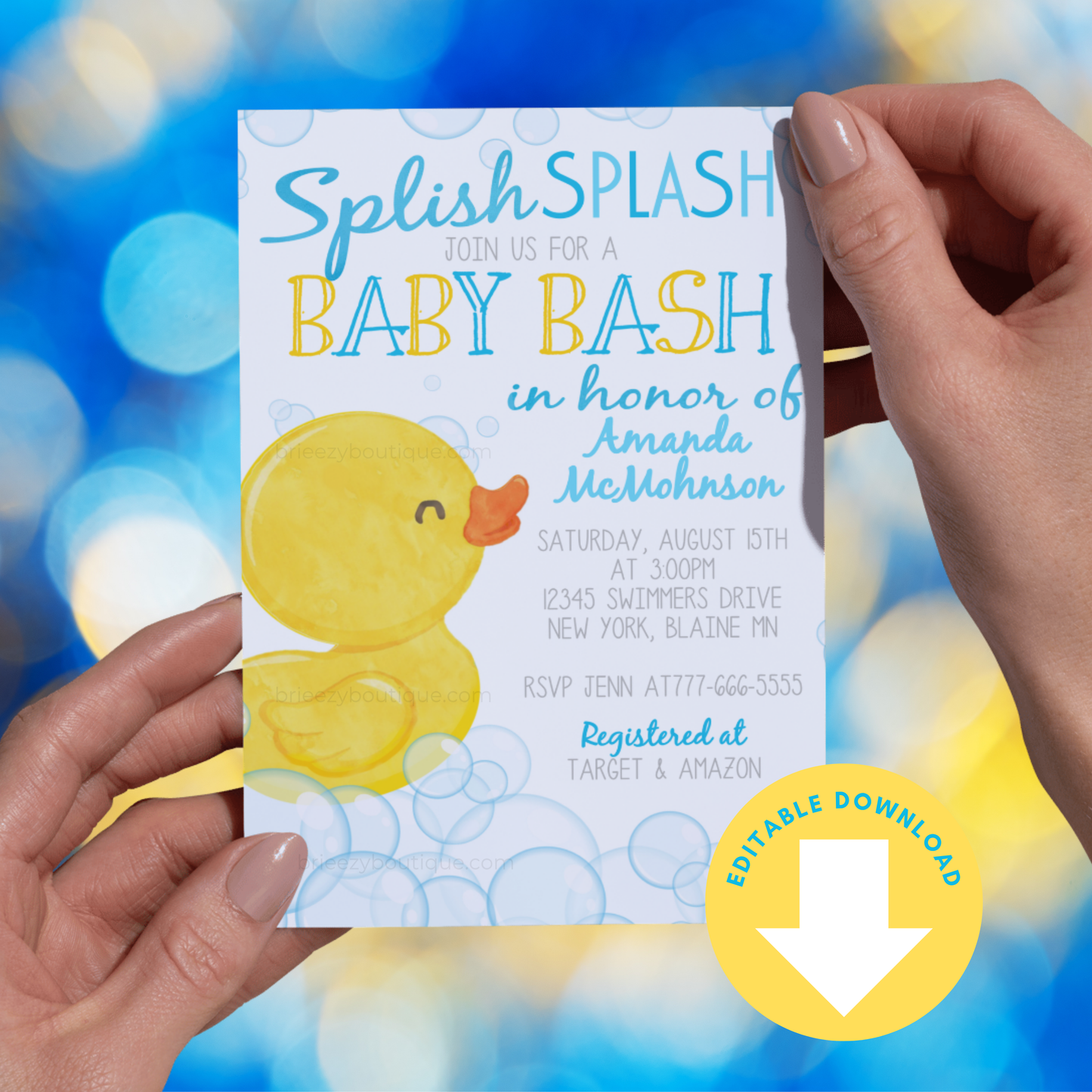 Baby shower invitation with a rubber duck design held by hands against a colorful blurred background.